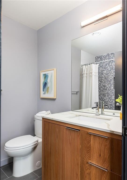 bathroom featuring vanity, tile patterned floors, toilet, and a shower with shower curtain