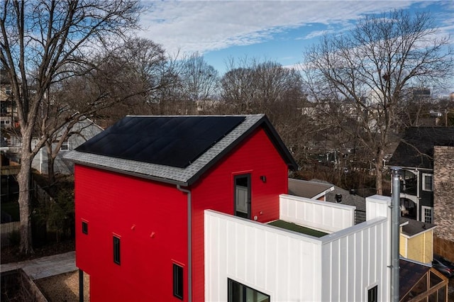 view of outdoor structure featuring solar panels