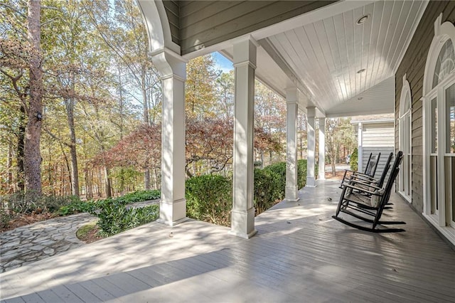 wooden terrace with a porch