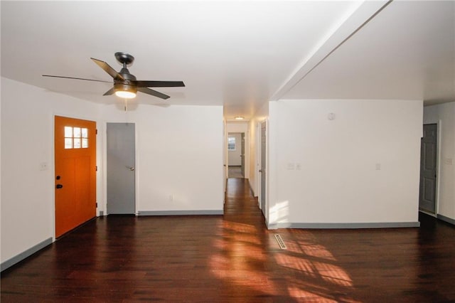 entryway with a ceiling fan, wood finished floors, and baseboards