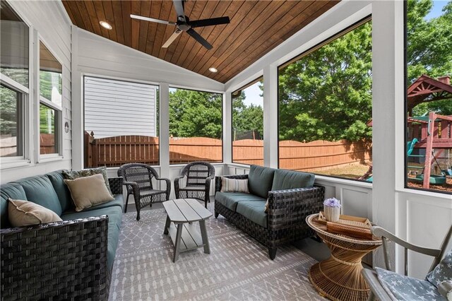 sunroom / solarium featuring outdoor lounge area, ceiling fan, and vaulted ceiling