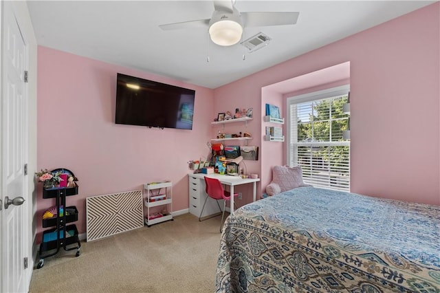 carpeted bedroom featuring baseboards and ceiling fan