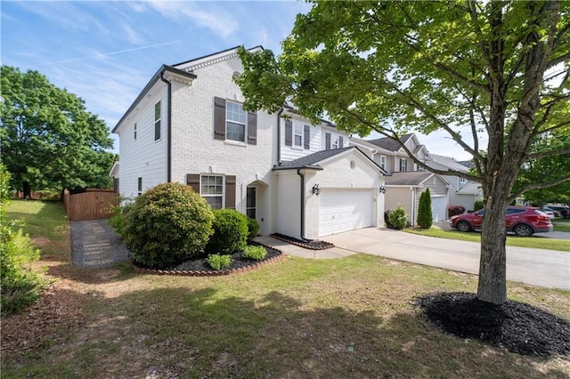 view of front of home with driveway, brick siding, and an attached garage