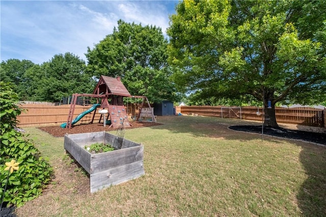 view of yard with a storage unit, a playground, and an outdoor structure