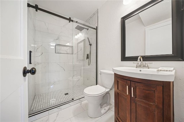 bathroom with vanity, an enclosed shower, and toilet