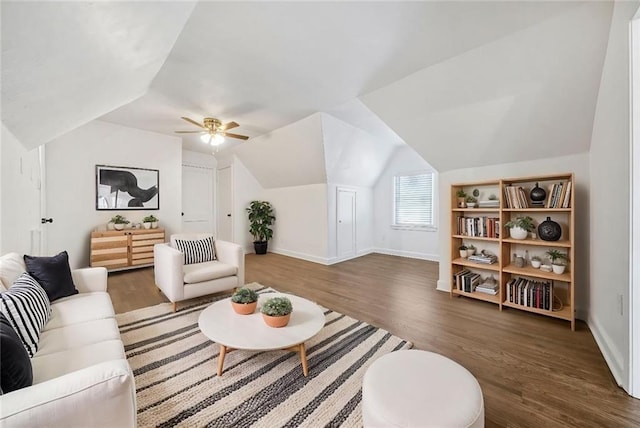 living room with lofted ceiling, dark wood-type flooring, and ceiling fan