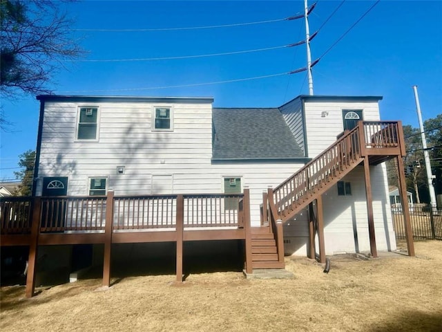 back of house featuring a wooden deck