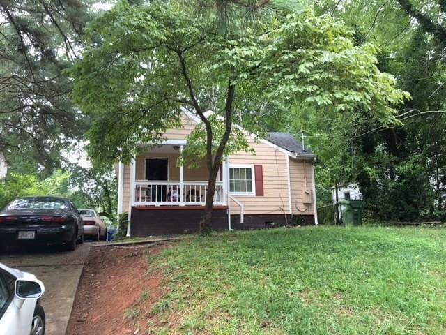 1566 Avon Ave SW, Atlanta, GA 30311 - view of front of property featuring crawl space and a front lawn