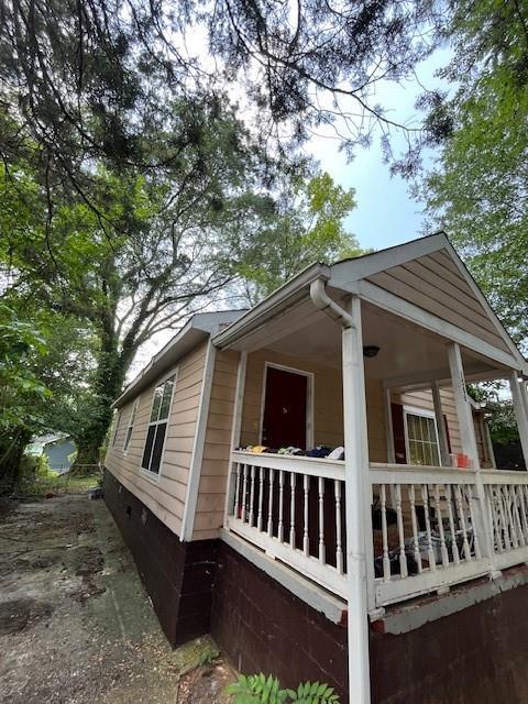 1566 Avon Ave SW, Atlanta, GA 30311 - view of home's exterior with covered porch and crawl space