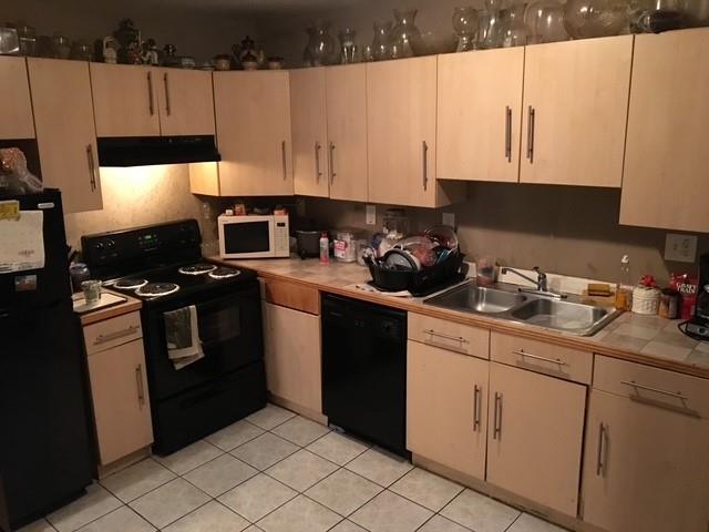 1566 Avon Ave SW, Atlanta, GA 30311 - washroom with washer / clothes dryer and light tile patterned floors