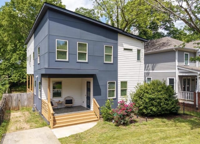 210 Locust St NE, Atlanta, GA 30317 - back of house with a lawn and fence