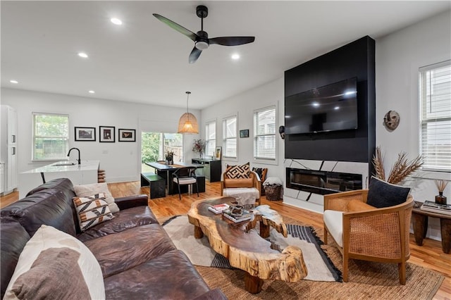 210 Locust St NE, Atlanta, GA 30317 - living area featuring a ceiling fan, recessed lighting, and light wood-type flooring