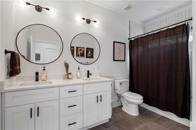 210 Locust St NE, Atlanta, GA 30317 - full bath with visible vents, a sink, double vanity, and toilet