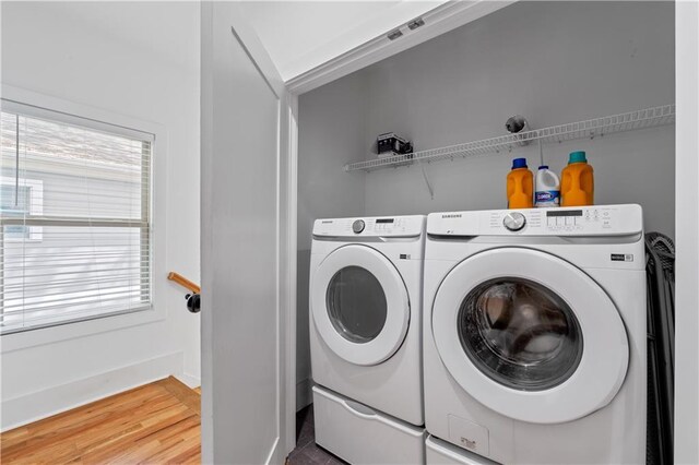 210 Locust St NE, Atlanta, GA 30317 - laundry area featuring washing machine and clothes dryer, laundry area, a wealth of natural light, and wood finished floors