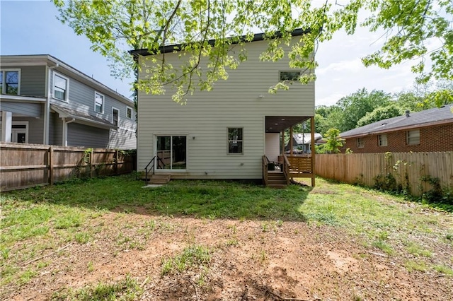 210 Locust St NE, Atlanta, GA 30317 - back of property featuring a yard, a deck, a fenced backyard, and entry steps