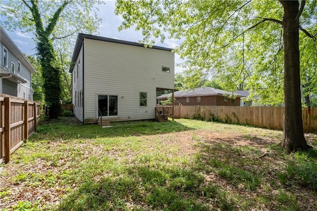 210 Locust St NE, Atlanta, GA 30317 - back of property featuring a lawn and a fenced backyard