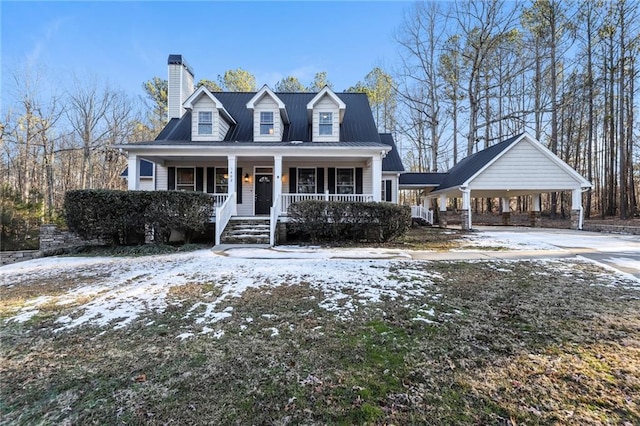 cape cod-style house with a porch and a carport