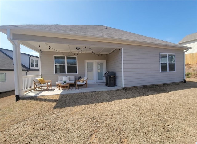 rear view of house with a patio and an outdoor hangout area