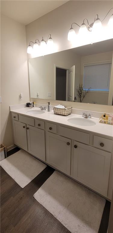 bathroom with hardwood / wood-style flooring and vanity