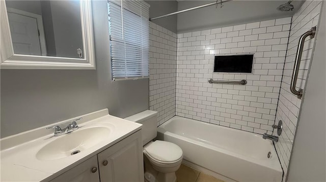 full bathroom with tile patterned floors, vanity, tiled shower / bath combo, and toilet