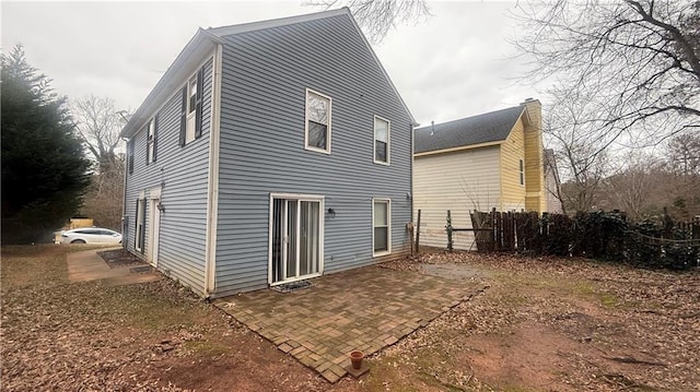 rear view of property featuring a patio