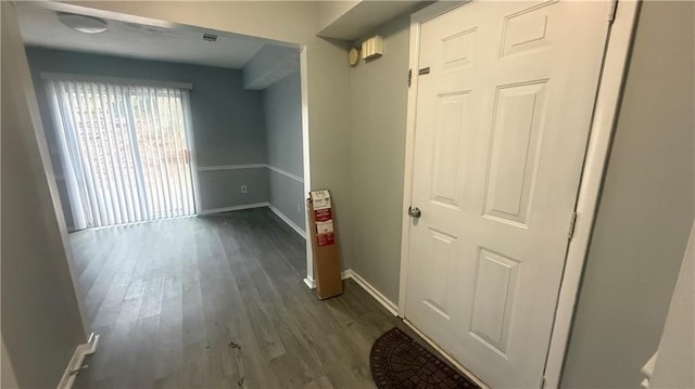 hall with dark hardwood / wood-style flooring