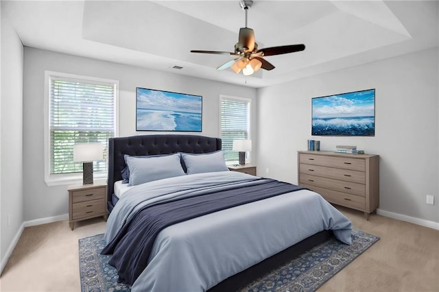 3315 Brookfield Dr, Austell, GA 30106 - bedroom with light carpet, a tray ceiling, and multiple windows