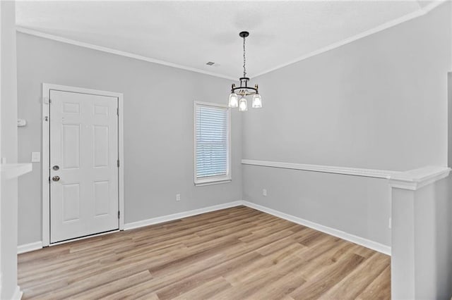 3315 Brookfield Dr, Austell, GA 30106 - empty room with a chandelier, light wood-style floors, crown molding, and baseboards