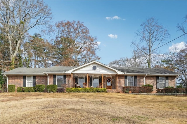 ranch-style house with a front lawn