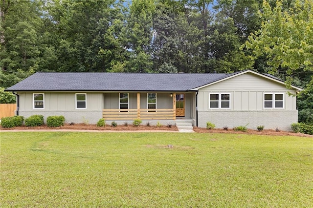 6142 Hutchins Dr, Buford, GA 30518 - ranch-style house with brick siding, board and batten siding, and a front yard