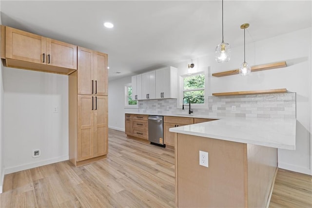 6142 Hutchins Dr, Buford, GA 30518 - kitchen featuring open shelves, a sink, dishwasher, a peninsula, and light wood-style flooring