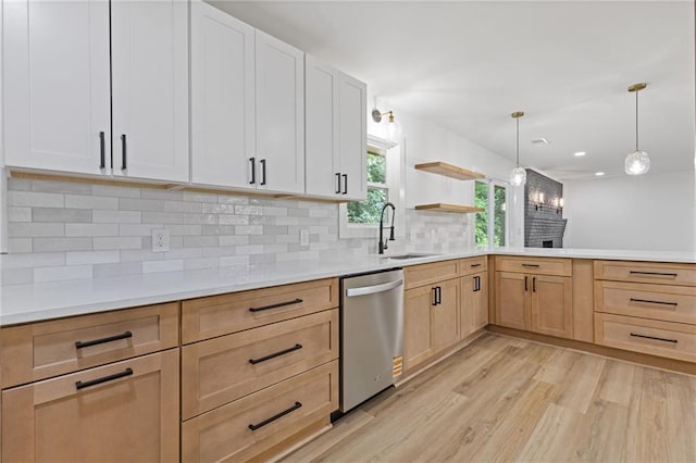 6142 Hutchins Dr, Buford, GA 30518 - kitchen with dishwasher, a sink, light brown cabinets, light wood-type flooring, and decorative backsplash