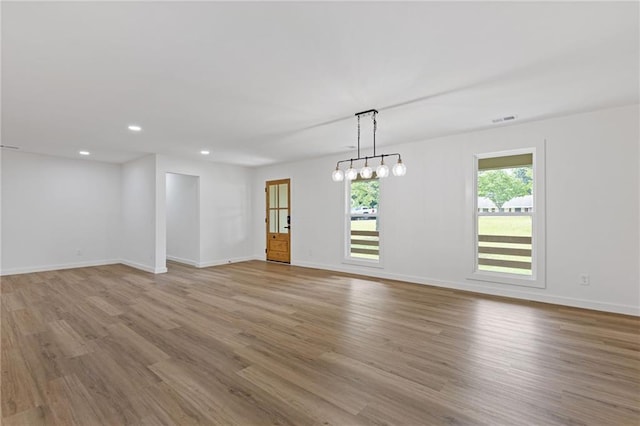 6142 Hutchins Dr, Buford, GA 30518 - empty room featuring wood finished floors, baseboards, and recessed lighting