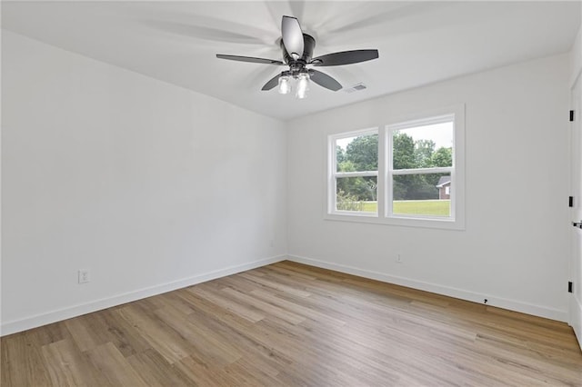 6142 Hutchins Dr, Buford, GA 30518 - spare room with light wood-type flooring, baseboards, and a ceiling fan