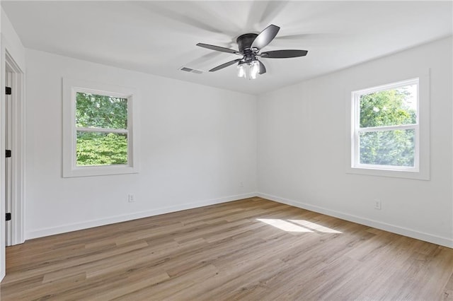 6142 Hutchins Dr, Buford, GA 30518 - spare room with light wood-style floors, baseboards, and ceiling fan
