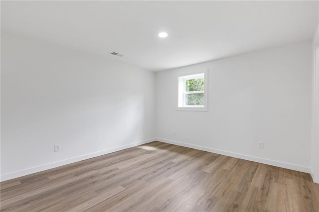 6142 Hutchins Dr, Buford, GA 30518 - empty room featuring light wood-style flooring, baseboards, and recessed lighting