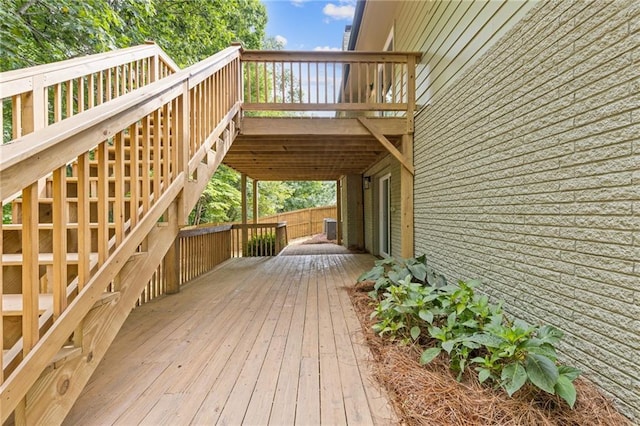 6142 Hutchins Dr, Buford, GA 30518 - wooden deck featuring central AC unit and stairway