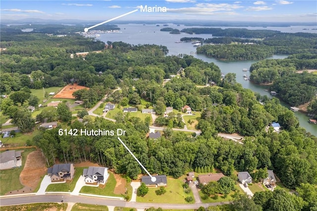 6142 Hutchins Dr, Buford, GA 30518 - aerial overview of property's location featuring a nearby body of water and a heavily wooded area