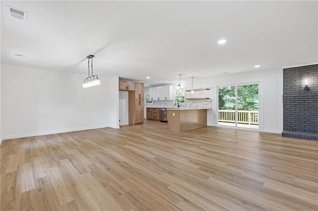 6142 Hutchins Dr, Buford, GA 30518 - unfurnished living room featuring light wood-style floors, baseboards, and recessed lighting