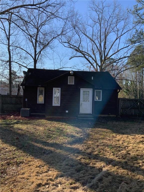 view of front of property with entry steps, fence, and central AC unit