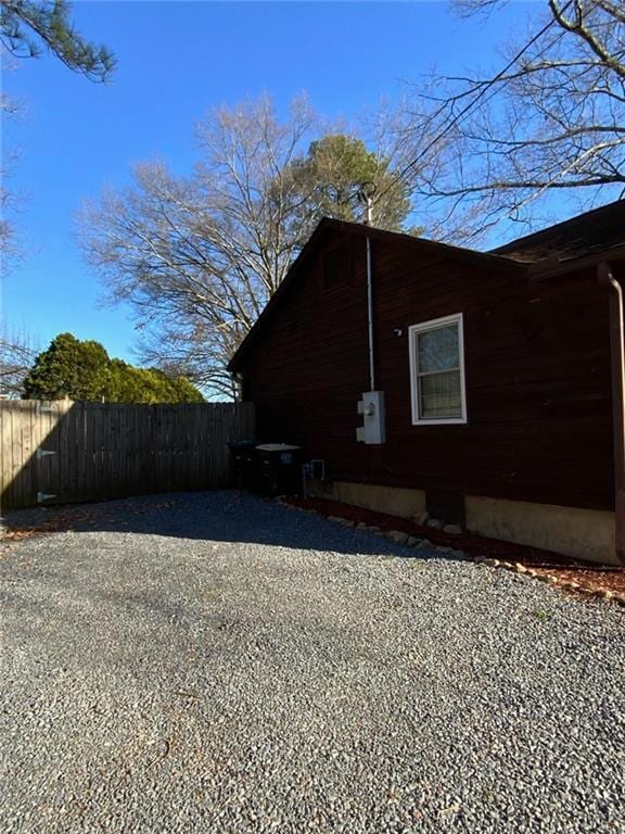 view of side of home with fence