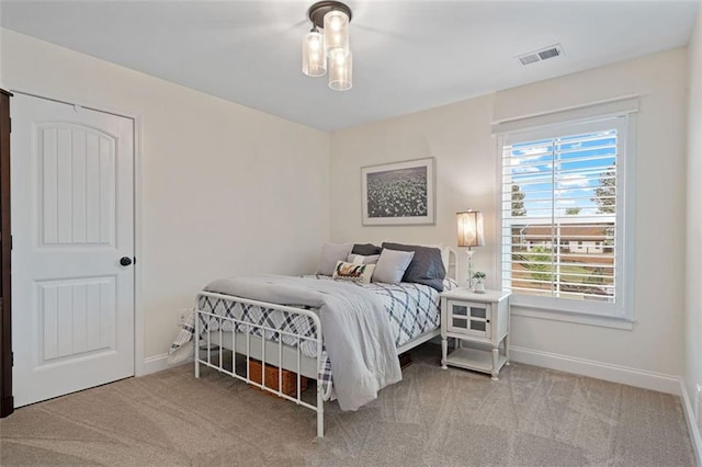 7935 Welch Ml, Ball Ground, GA 30107 - bedroom featuring baseboards, visible vents, and carpet