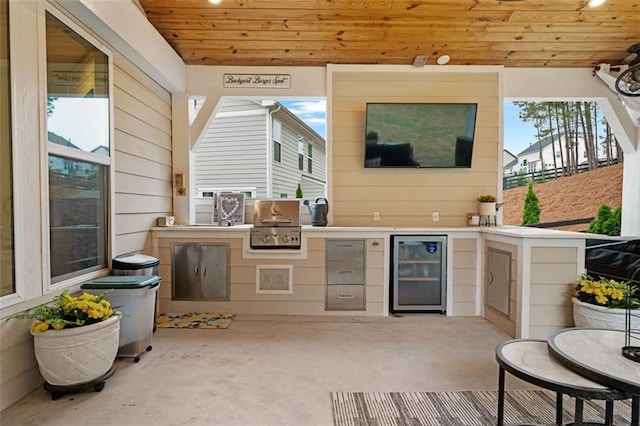 7935 Welch Ml, Ball Ground, GA 30107 - view of patio / terrace featuring beverage cooler, an outdoor kitchen, and a grill