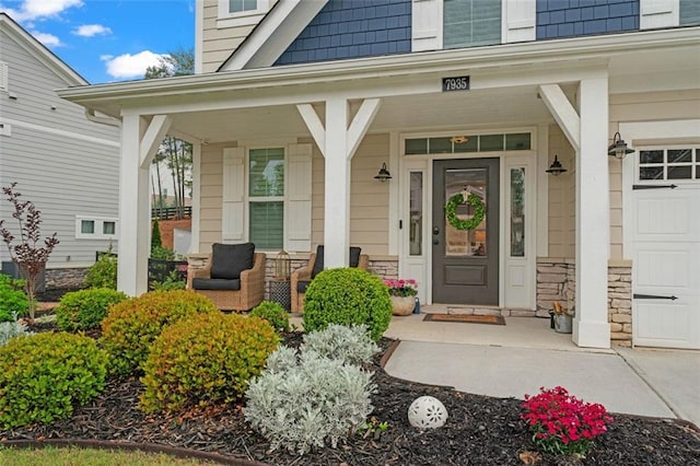 7935 Welch Ml, Ball Ground, GA 30107 - view of exterior entry featuring a porch and stone siding