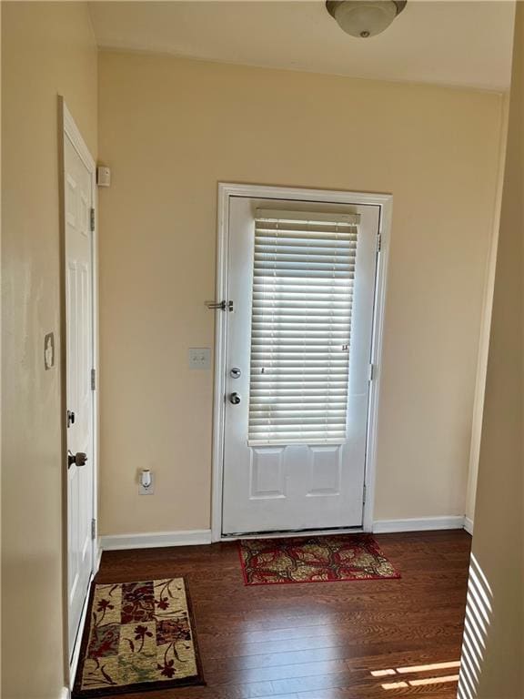 doorway featuring dark hardwood / wood-style floors