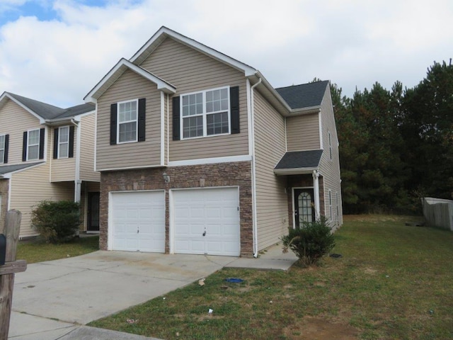 view of front of property with a front lawn and a garage