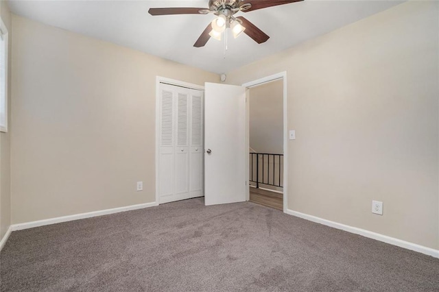 unfurnished bedroom featuring carpet, a closet, and ceiling fan