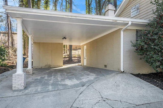 view of parking / parking lot featuring a carport