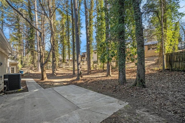 view of yard featuring a patio and central AC unit