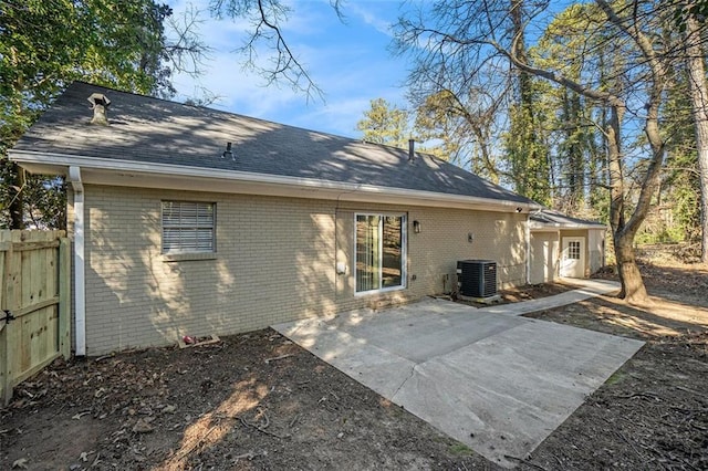 rear view of house featuring a patio and central air condition unit